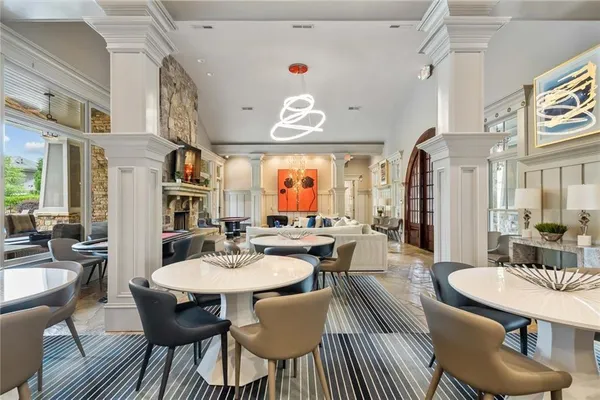 a room with pool table and windows