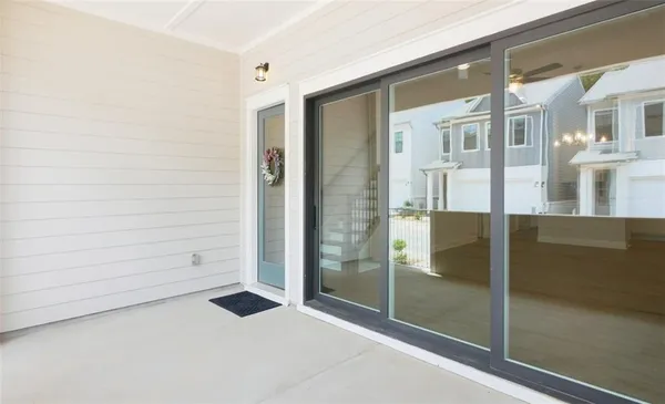 wooden floor in an empty room with a kitchen