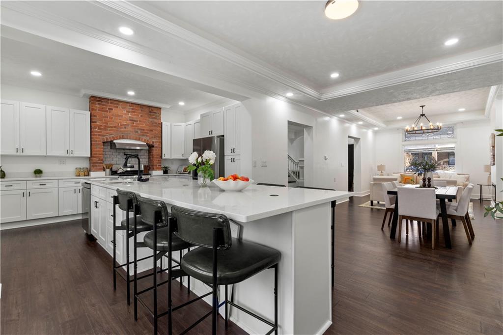1105 Portland Street Pittsburgh, PA 15206 - Photo 14 of 48 a large kitchen with a table and chairs