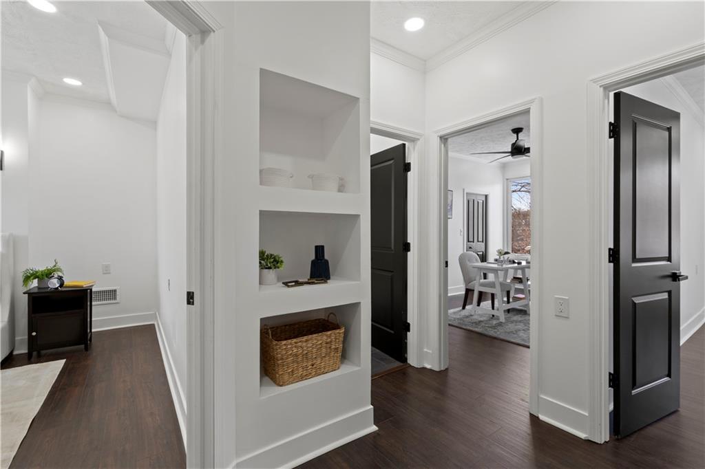 1105 Portland Street Pittsburgh, PA 15206 - Photo 20 of 48 a view of a hallway with couch and wooden floor in a kitchen