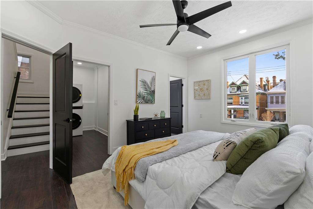 1105 Portland Street Pittsburgh, PA 15206 - Photo 22 of 48 a bedroom with a large bed and a walk in closet