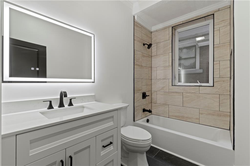 1105 Portland Street Pittsburgh, PA 15206 - Photo 31 of 48 a bathroom with a sink a toilet and shower