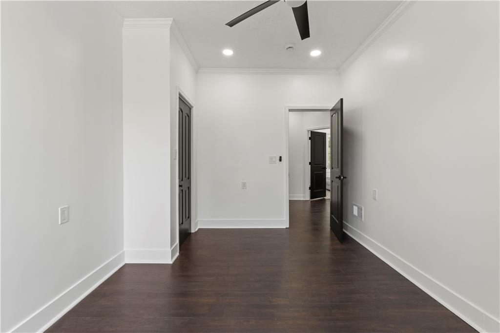 1105 Portland Street Pittsburgh, PA 15206 - Photo 33 of 48 an empty room with wooden floor and windows