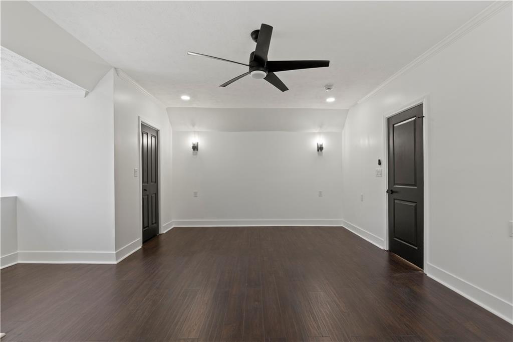 1105 Portland Street Pittsburgh, PA 15206 - Photo 37 of 48 an empty room with wooden floor ceiling fan and window