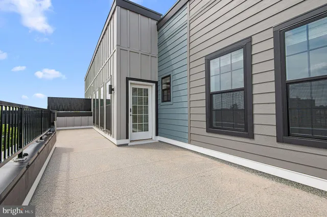 a view of a balcony with floor to ceiling window