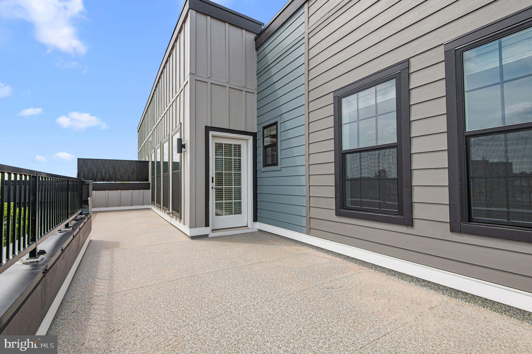 26 South York Road, Unit 410 Hatboro, PA 19040 - Photo 20 of 22 a view of a balcony with floor to ceiling window