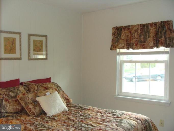 307 Bryanstone Road Reisterstown, MD 21136 - Photo 14 of 25 a bedroom with a bed and a window