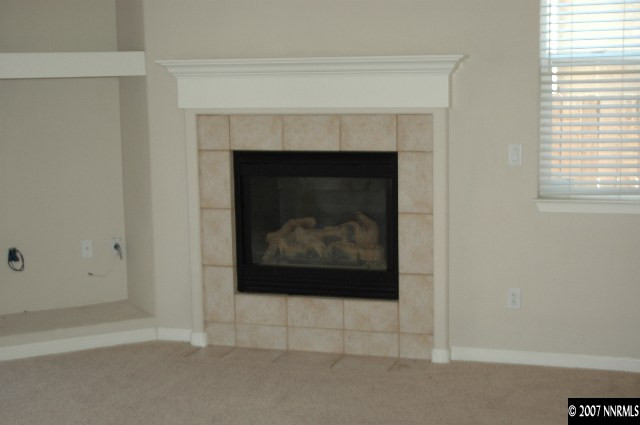 10587 Bliss Court Reno, NV 89521 - Photo 5 of 9 a living room with a fireplace