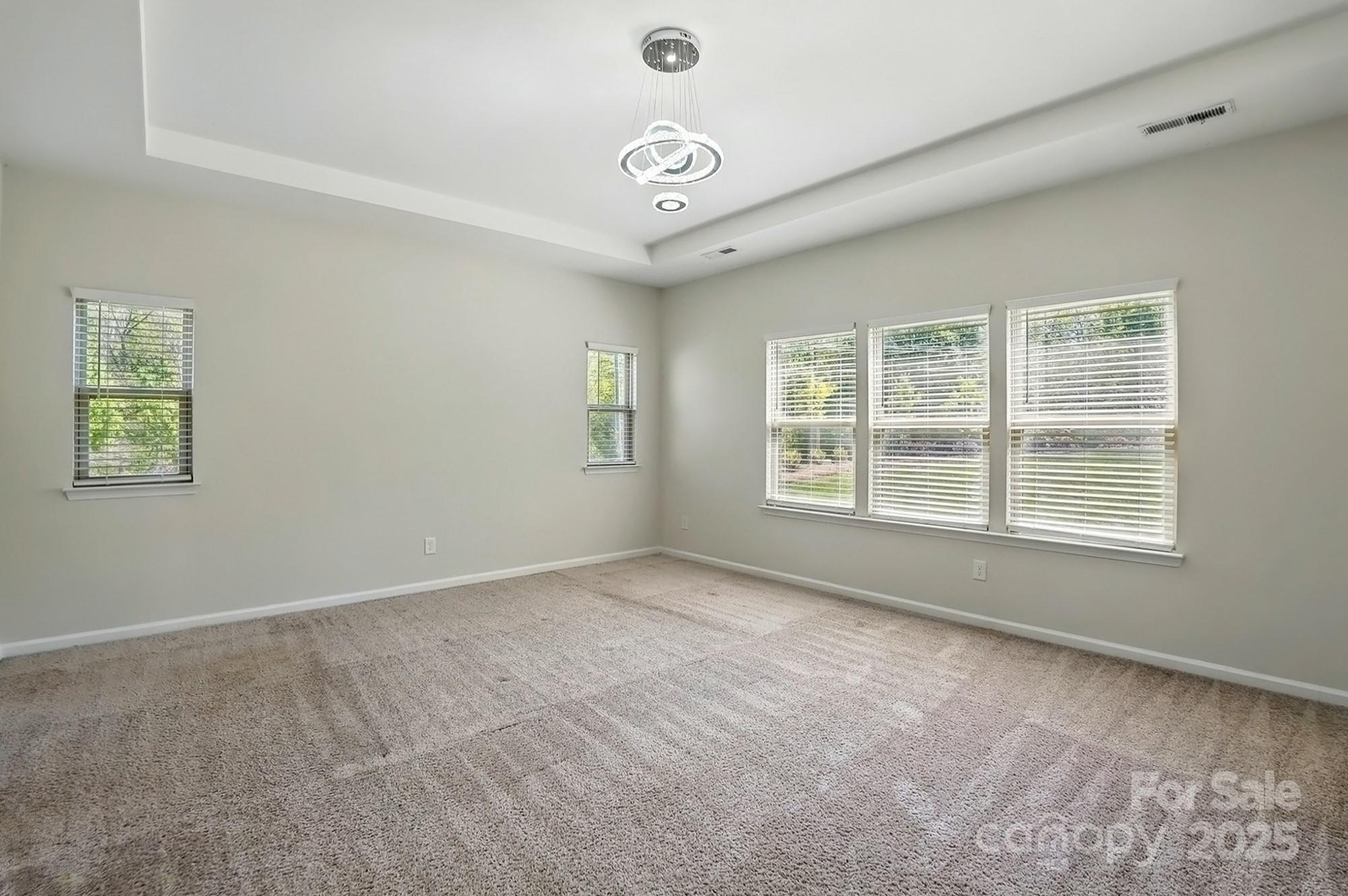 20422 Creek Bend Edge Court Matthews, NC 28105 - Photo 17 of 39 an empty room with windows and entrance