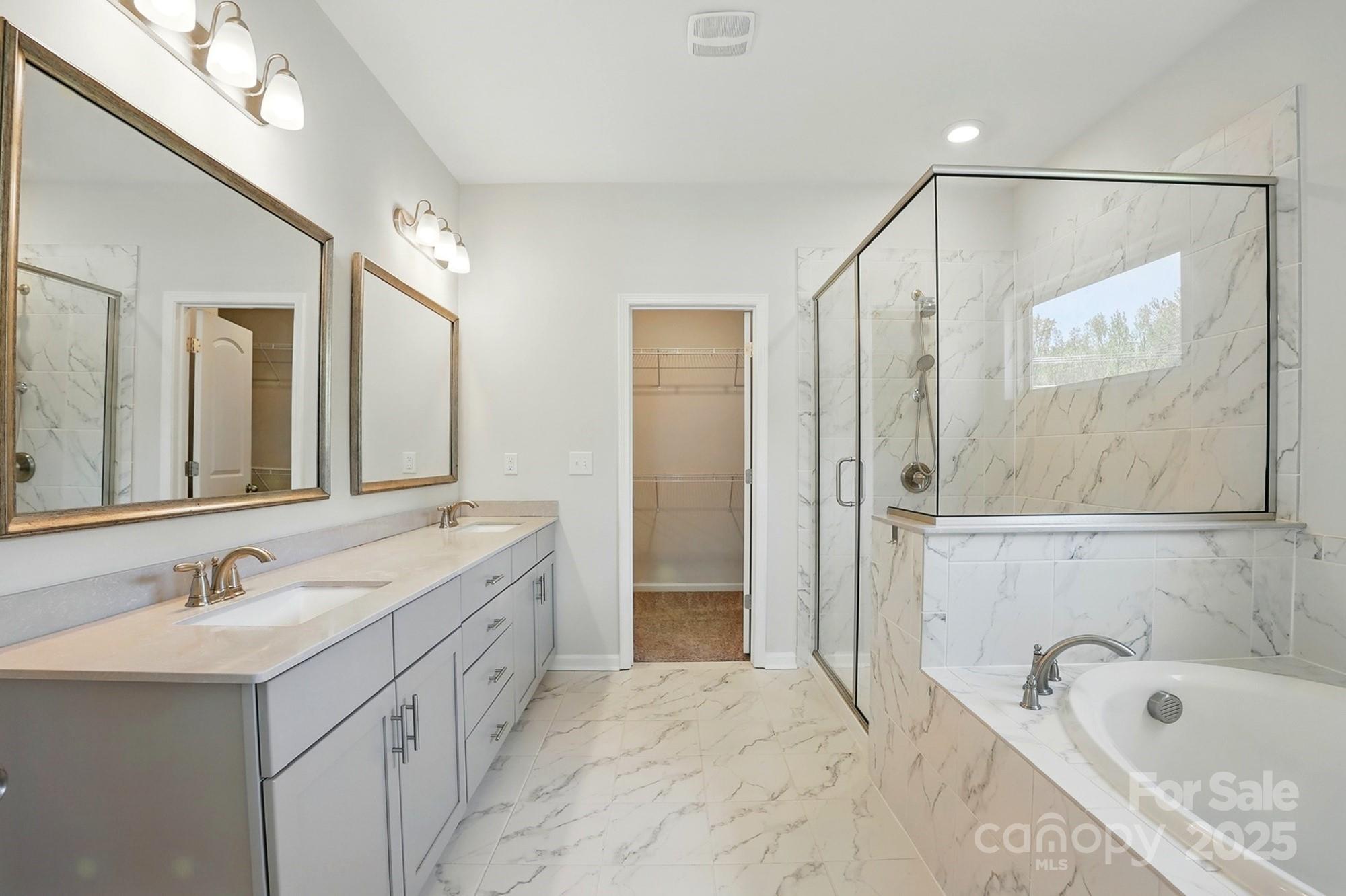 20422 Creek Bend Edge Court Matthews, NC 28105 - Photo 20 of 39 a bathroom with a tub sink and mirror