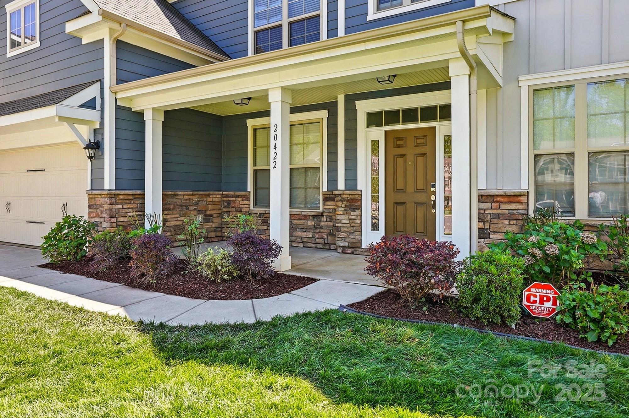 20422 Creek Bend Edge Court Matthews, NC 28105 - Photo 2 of 39 a front view of a house with garden