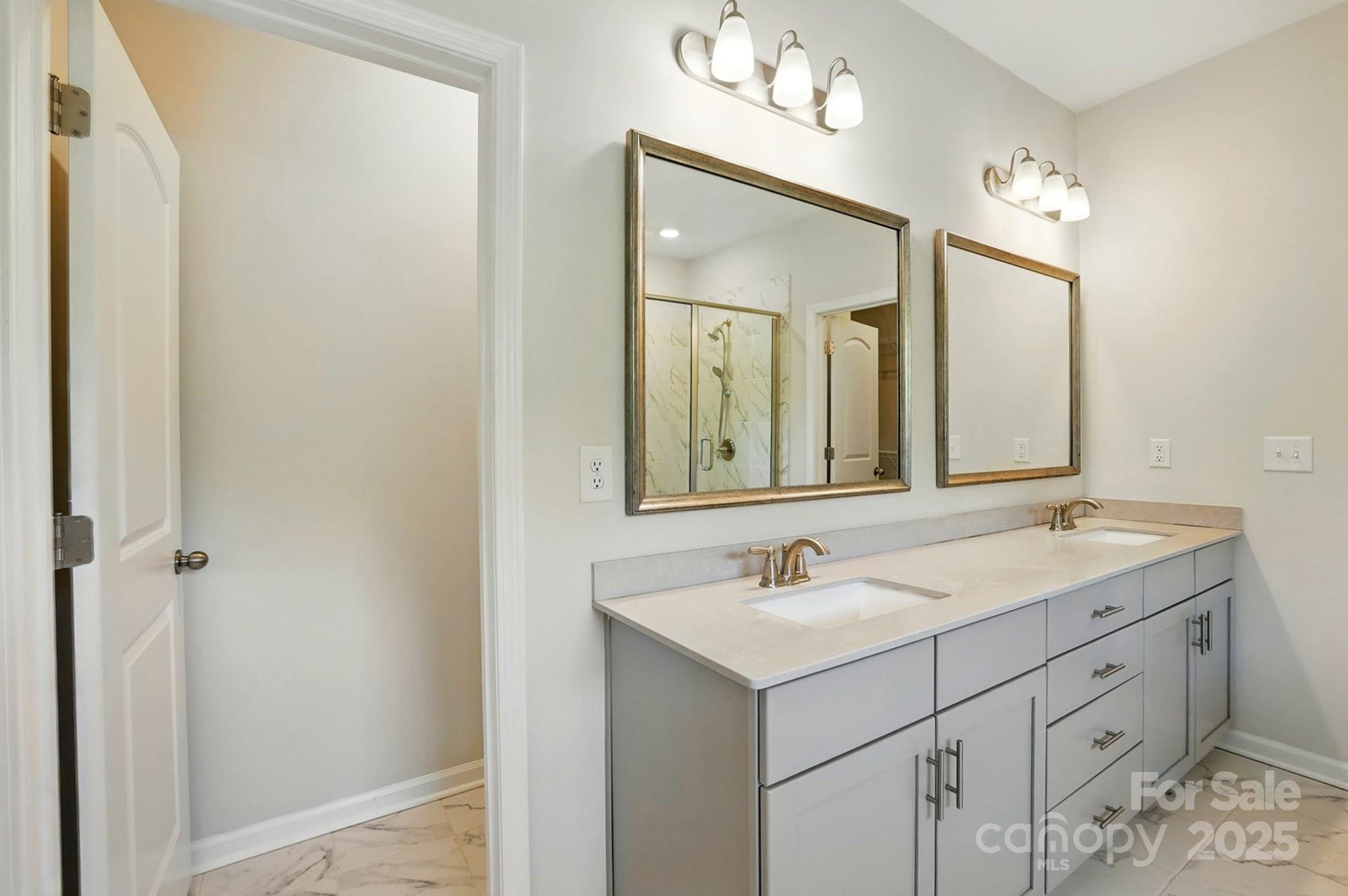 20422 Creek Bend Edge Court Matthews, NC 28105 - Photo 21 of 39 a bathroom with a sink vanity and mirror