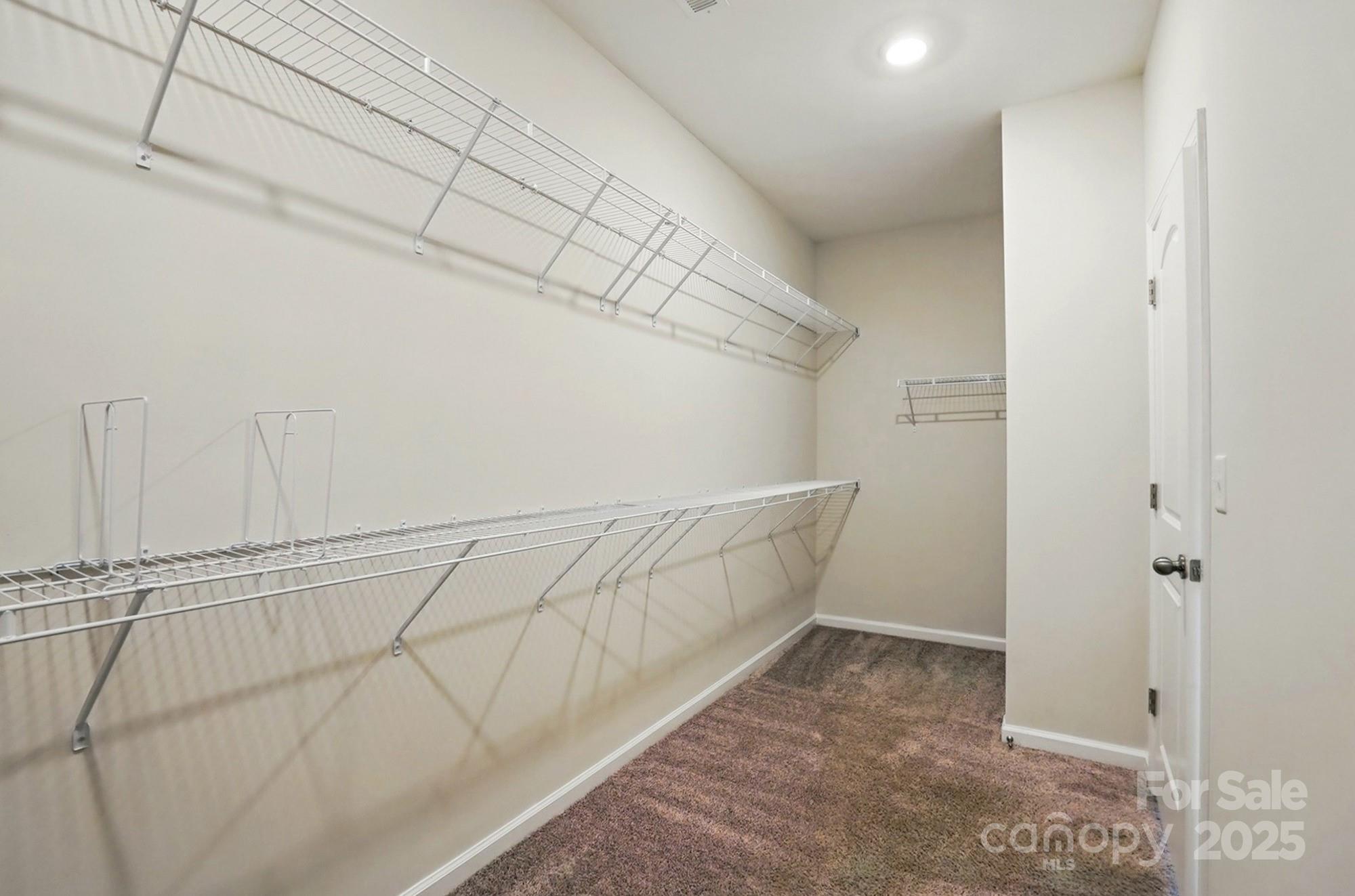 20422 Creek Bend Edge Court Matthews, NC 28105 - Photo 23 of 39 a view of a room with racks on the wall