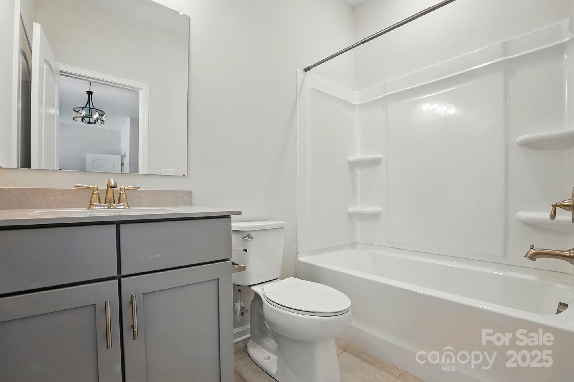 20422 Creek Bend Edge Court Matthews, NC 28105 - Photo 26 of 39 a bathroom with a sink a toilet and shower