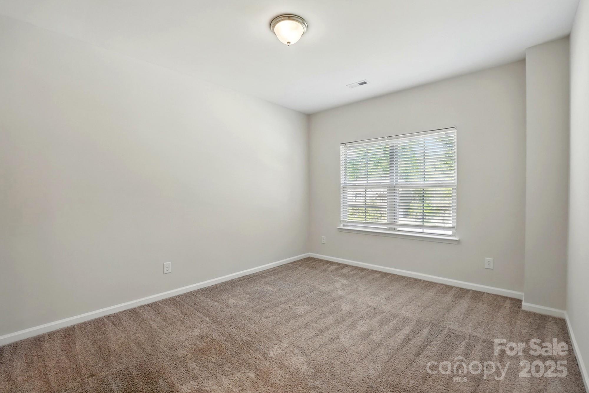 20422 Creek Bend Edge Court Matthews, NC 28105 - Photo 27 of 39 an empty room with a window