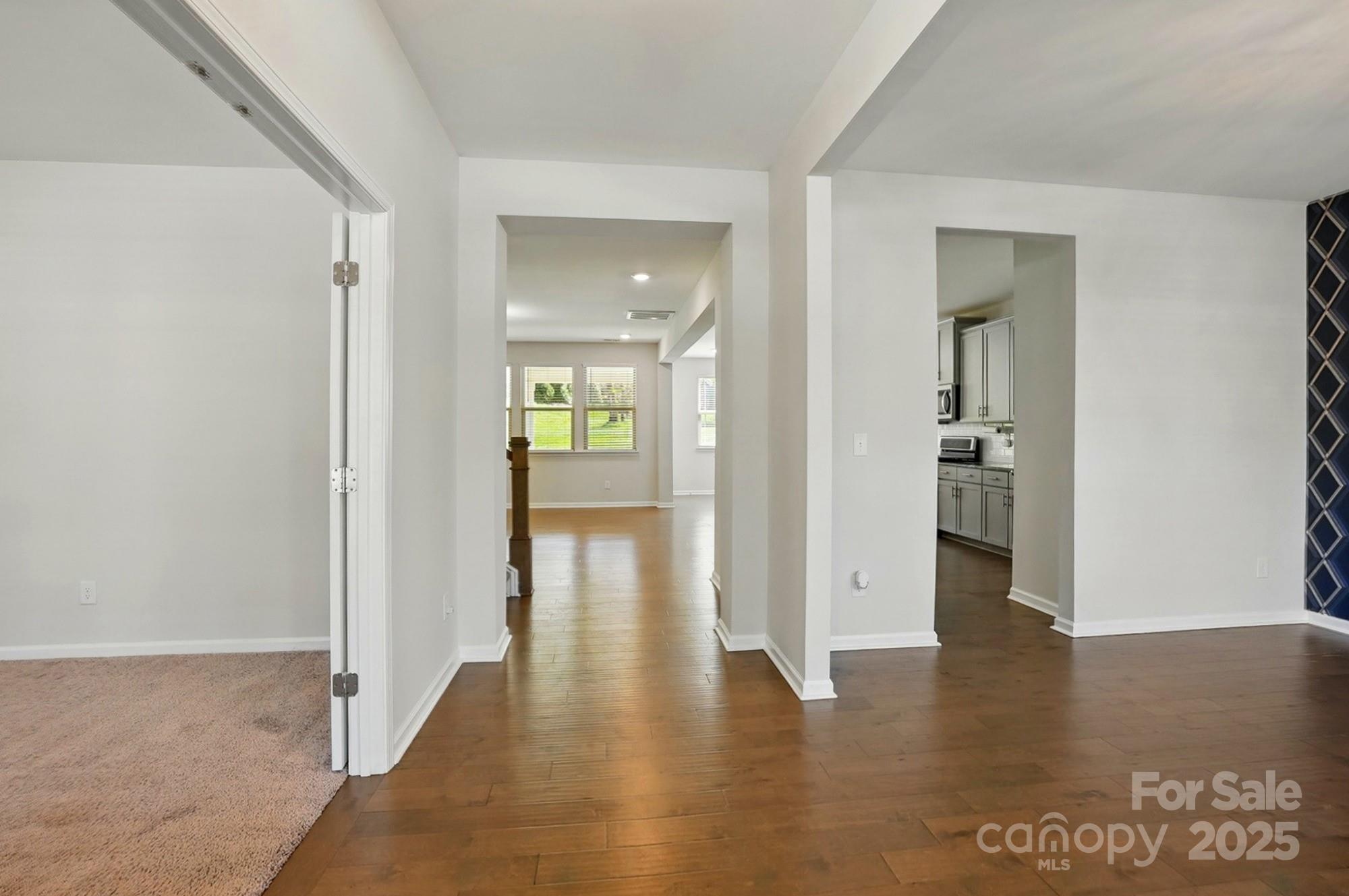 20422 Creek Bend Edge Court Matthews, NC 28105 - Photo 3 of 39 wooden floor with a table in a room