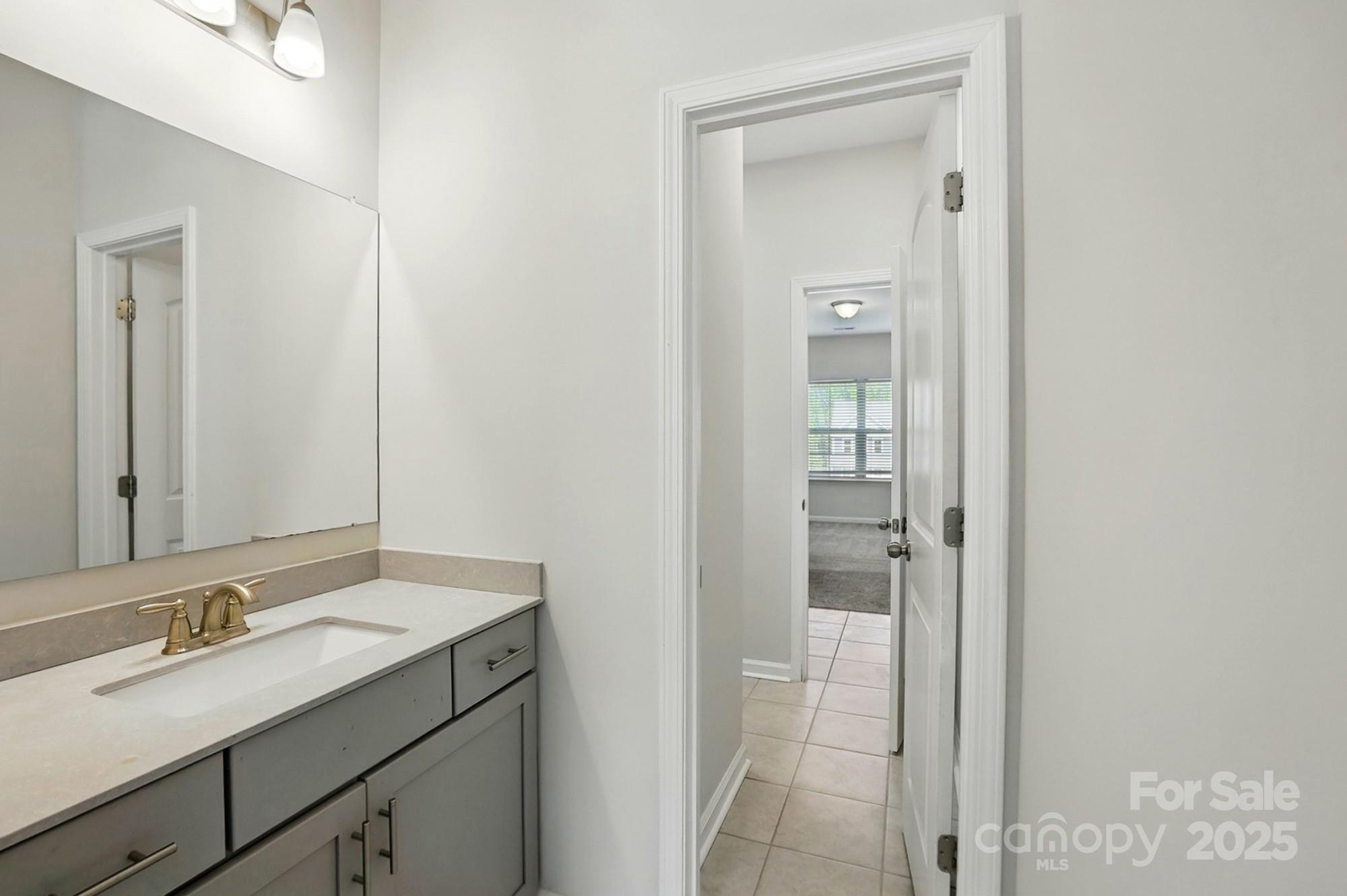 20422 Creek Bend Edge Court Matthews, NC 28105 - Photo 31 of 39 a bathroom with a sink and a mirror