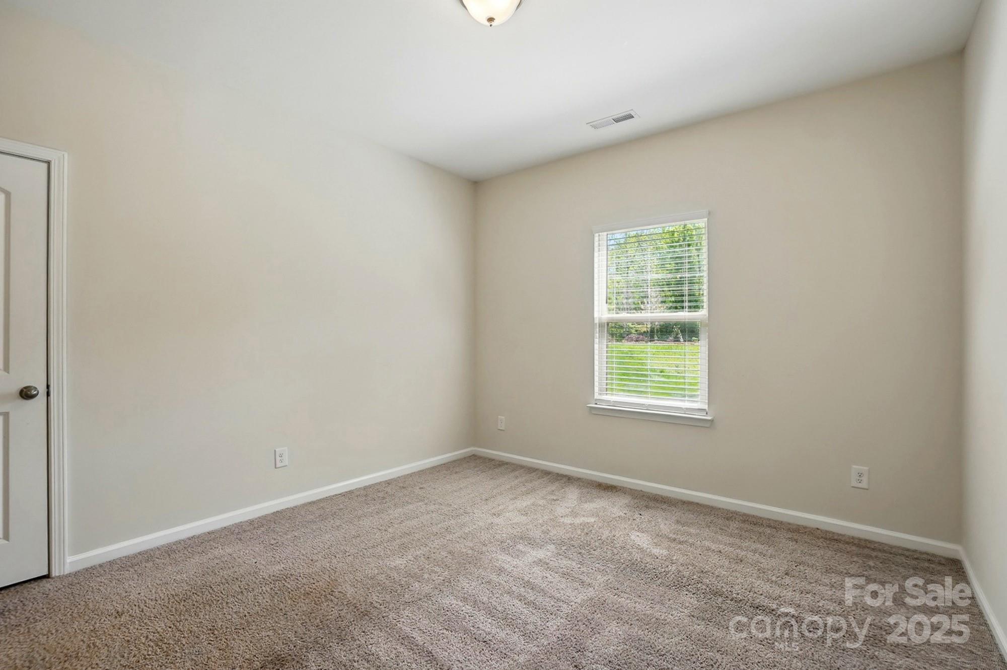 20422 Creek Bend Edge Court Matthews, NC 28105 - Photo 32 of 39 an empty room with a window