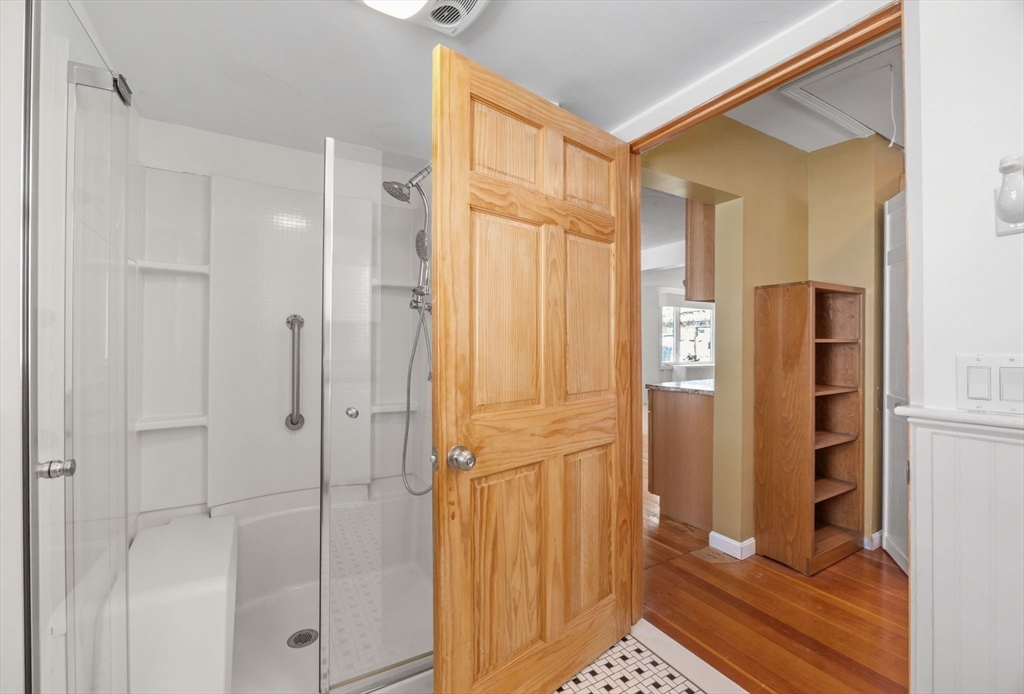 7 Grove Street Wareham, MA 02558 - Photo 19 of 41 a bathroom with a shower and a glass door