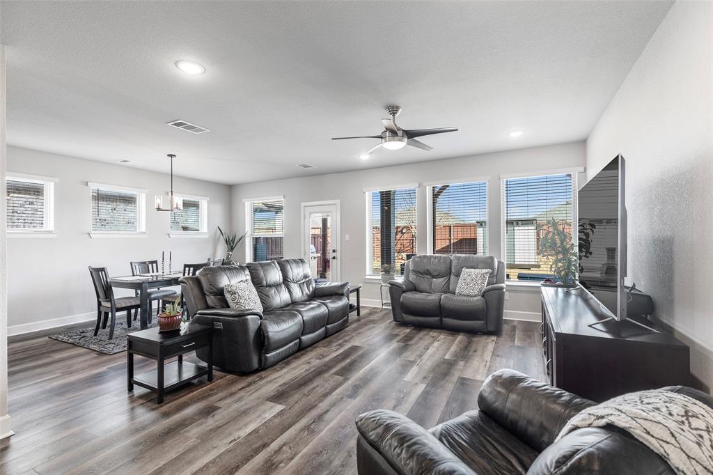 905 Bent Brook Road Little Elm, TX 75068 - Photo 17 of 40 a living room with furniture and a flat screen tv