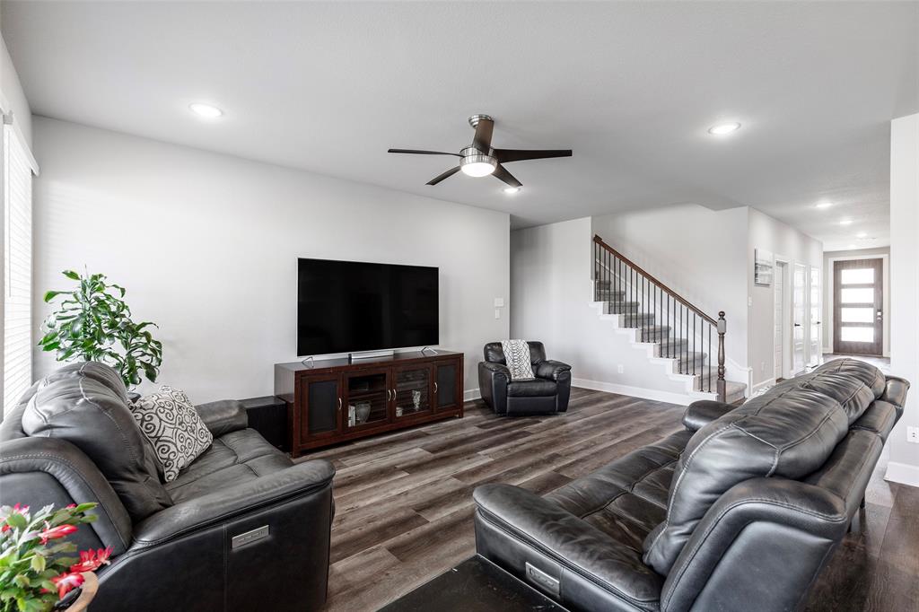 905 Bent Brook Road Little Elm, TX 75068 - Photo 18 of 40 a living room with furniture and a flat screen tv