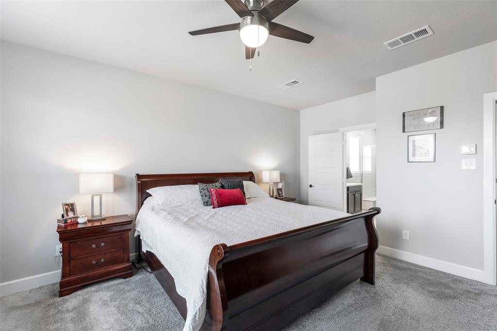 905 Bent Brook Road Little Elm, TX 75068 - Photo 20 of 40 a bedroom with a bed and a ceiling fan