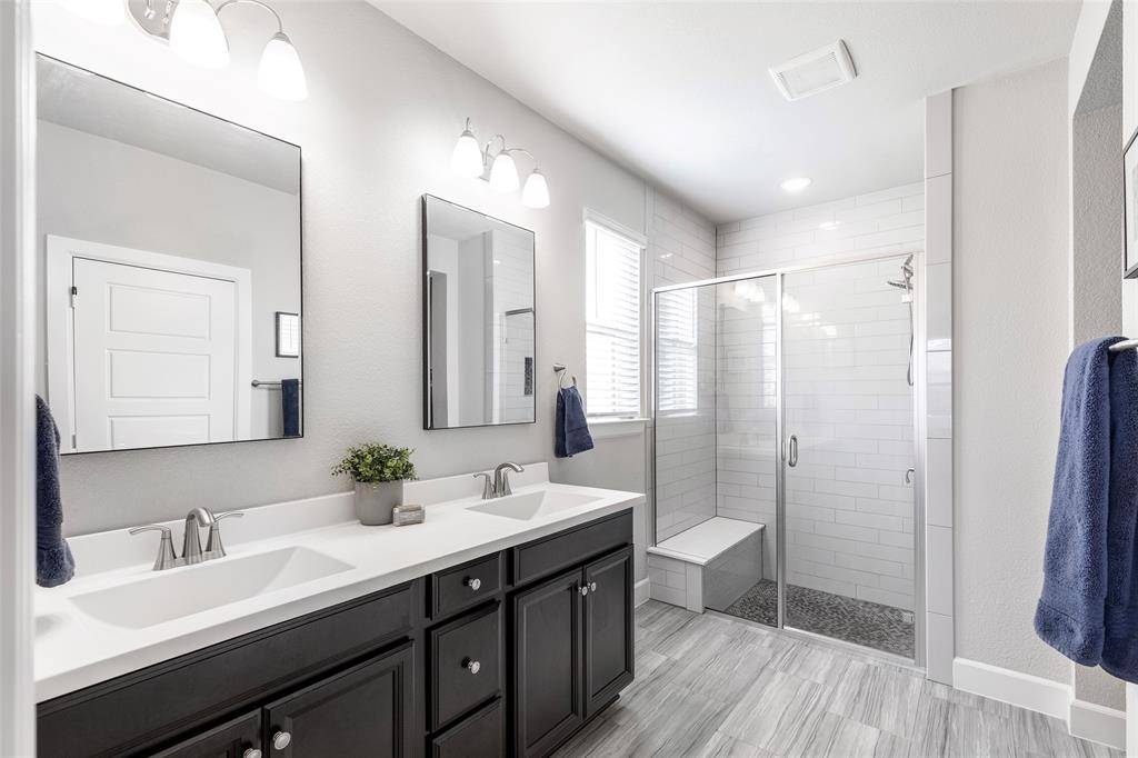 905 Bent Brook Road Little Elm, TX 75068 - Photo 21 of 40 a bathroom with a double vanity sink mirror double and shower