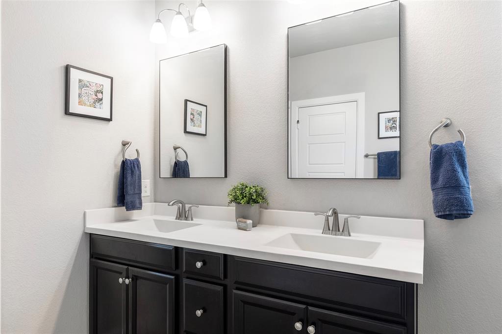 905 Bent Brook Road Little Elm, TX 75068 - Photo 22 of 40 a bathroom with double sink and two mirror