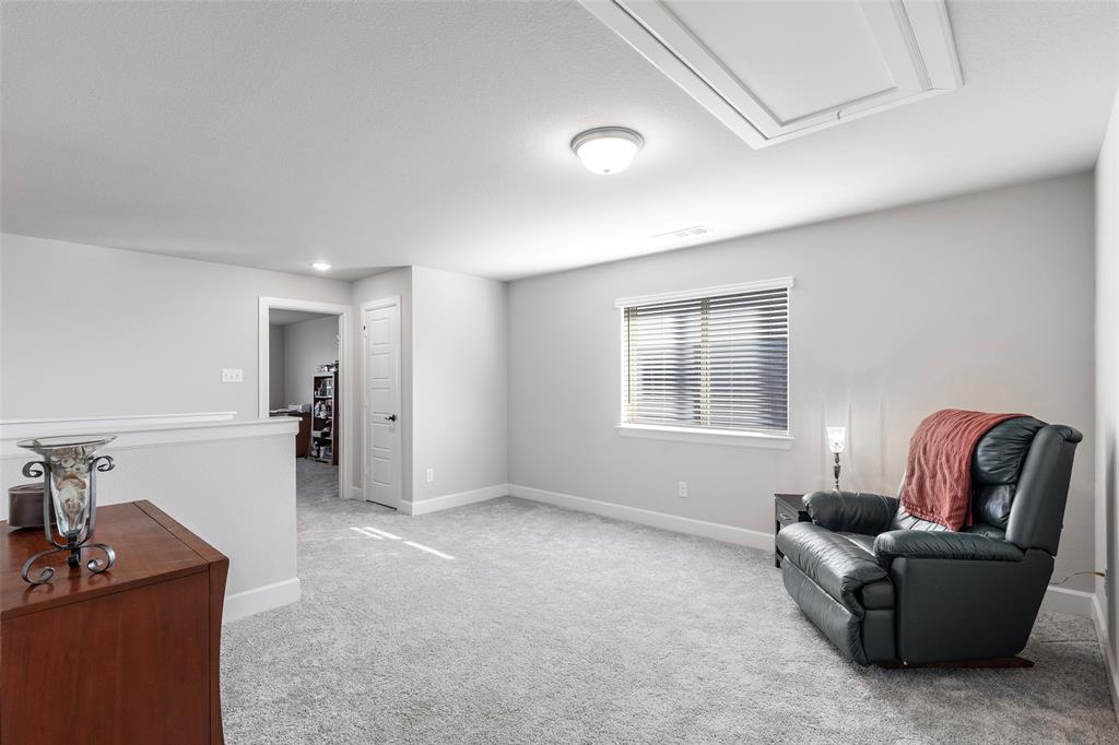 905 Bent Brook Road Little Elm, TX 75068 - Photo 25 of 40 a living room with furniture and a window