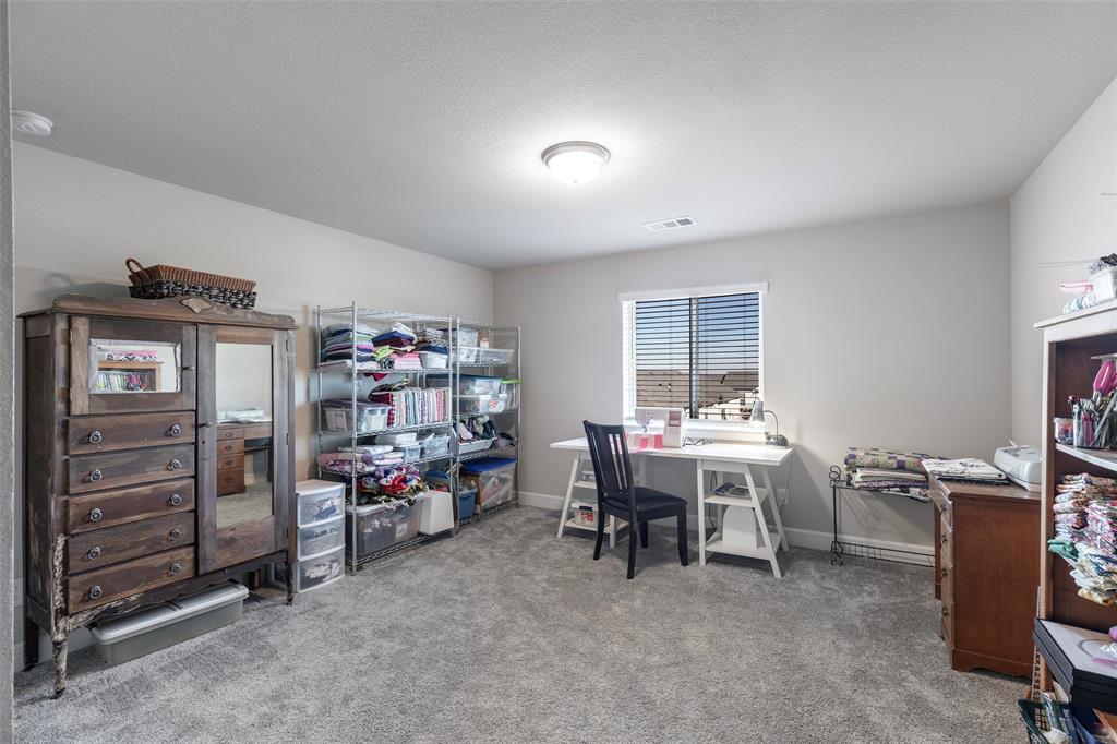905 Bent Brook Road Little Elm, TX 75068 - Photo 30 of 40 a view of a workspace with furniture and toys