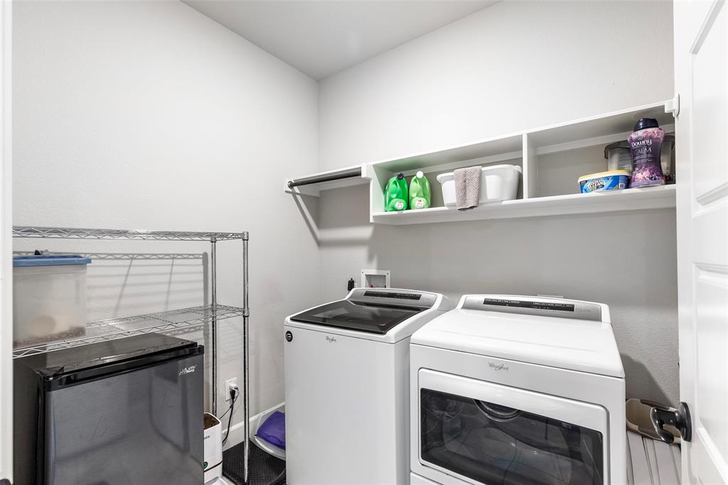 905 Bent Brook Road Little Elm, TX 75068 - Photo 32 of 40 a view of storage and utility room with washer and dryer