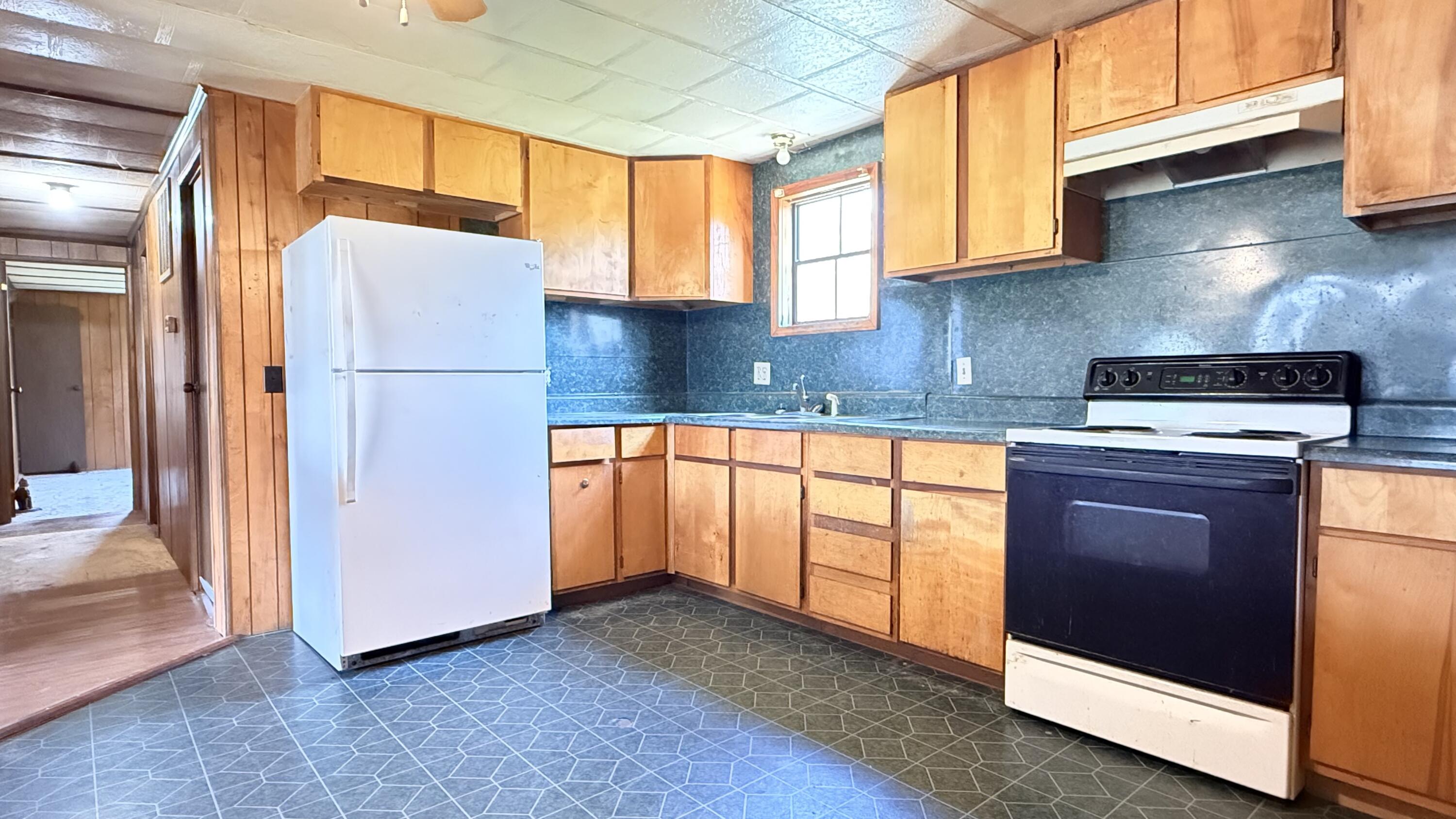 338 4th Street New Castle, VA 24127 - Photo 13 of 23 a kitchen with stainless steel appliances granite countertop a refrigerator sink and stove