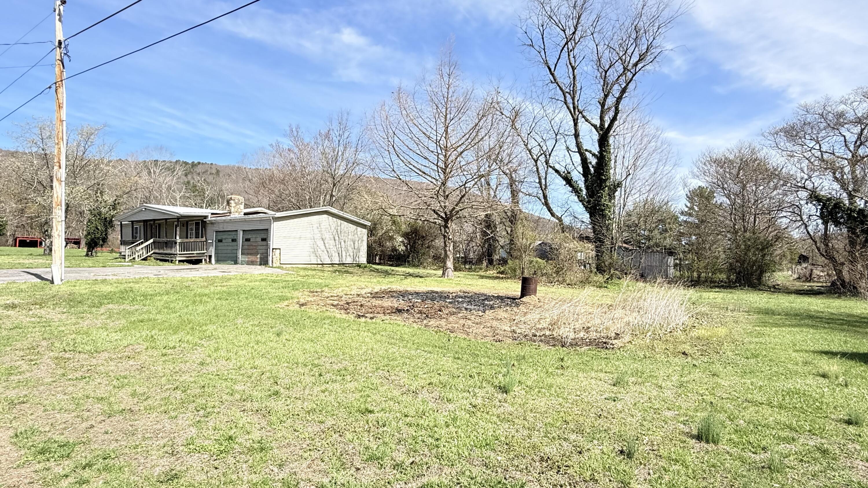 338 4th Street New Castle, VA 24127 - Photo 7 of 23 a view of a house with a yard