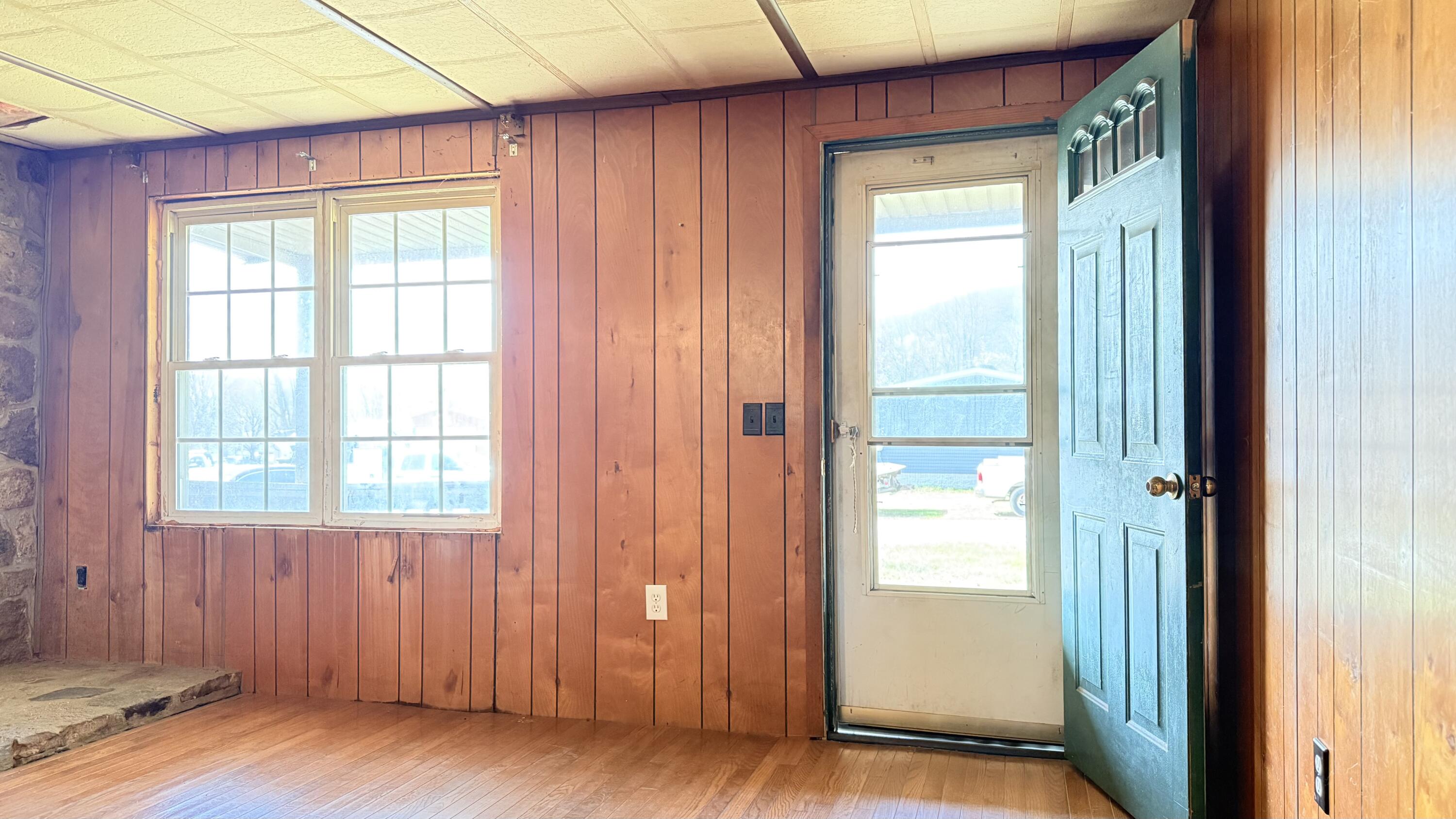 338 4th Street New Castle, VA 24127 - Photo 10 of 23 an empty room with wooden floor and windows