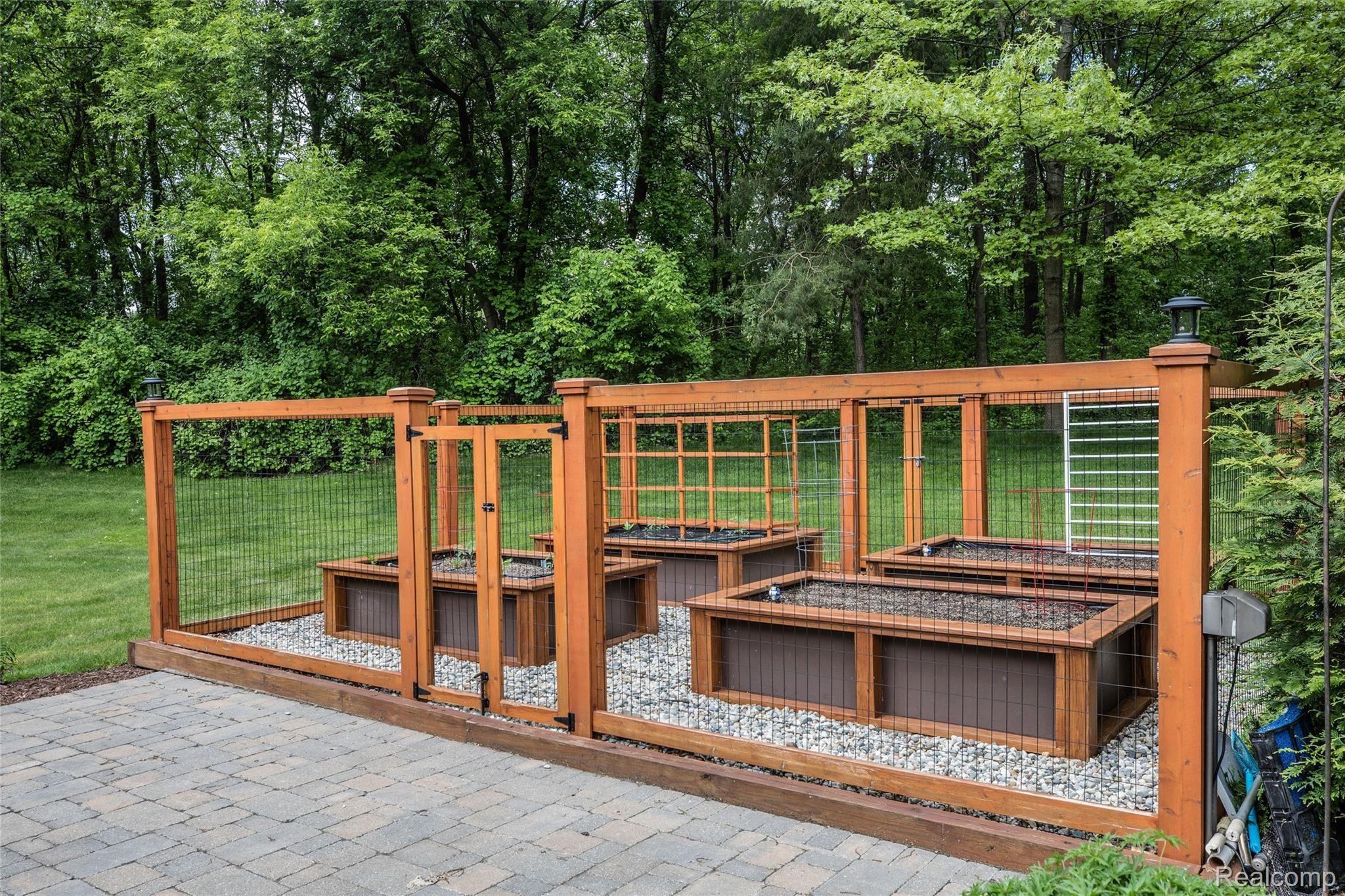 5542 Clarkston Road Clarkston, MI 48348 - Photo 67 of 85 BACK PATIO AND RAISED BED GARDEN