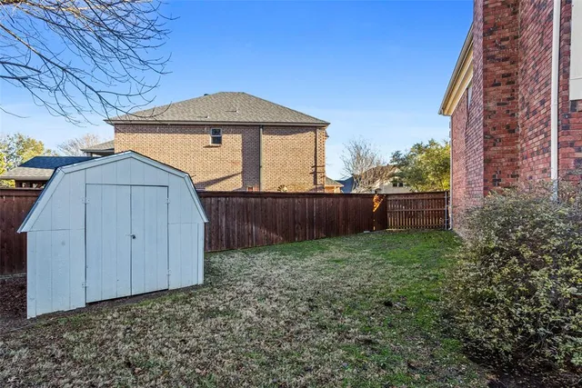 a view of a house with backyard patio and swimming pool