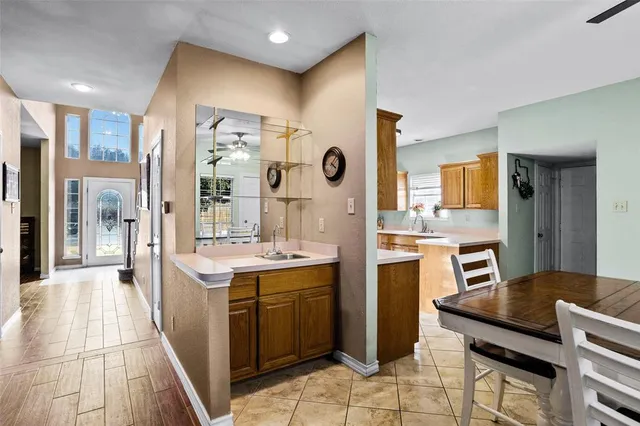 a kitchen with a sink stove and cabinets