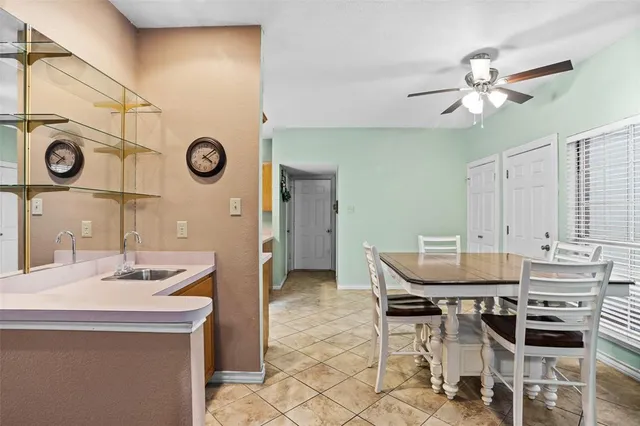 a kitchen with a table and chairs in it
