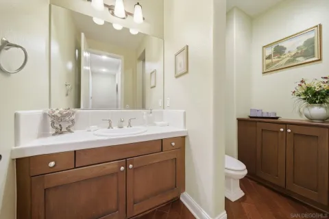 a large kitchen with stainless steel appliances granite countertop a lot of counter space and wooden floor