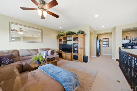a bedroom with furniture and a large window