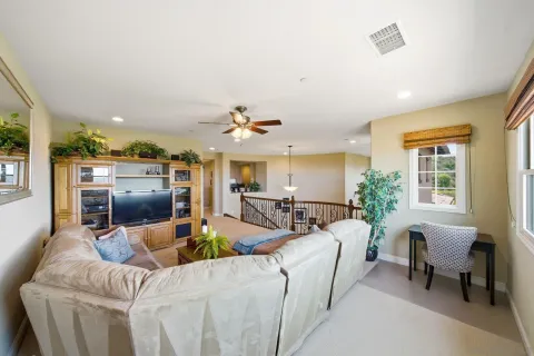 a living room with chairs and a table