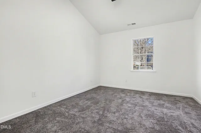 an empty room with fan