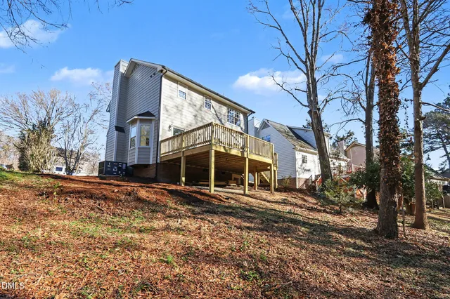 a view of balcony with wooden floor and fence