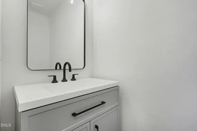 a view of a kitchen with a sink wooden floor and a window