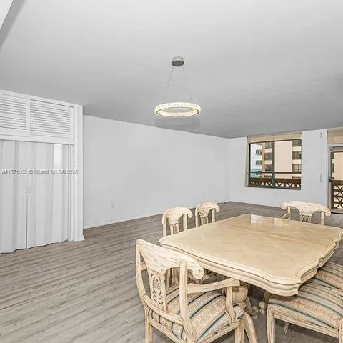 a dining room with table and chair