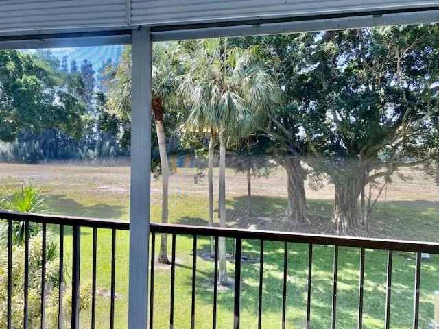a view of balcony with wooden floor