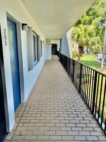 a view of a garden and swimming pool
