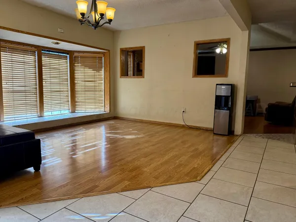 a view of livingroom with workspace and a window
