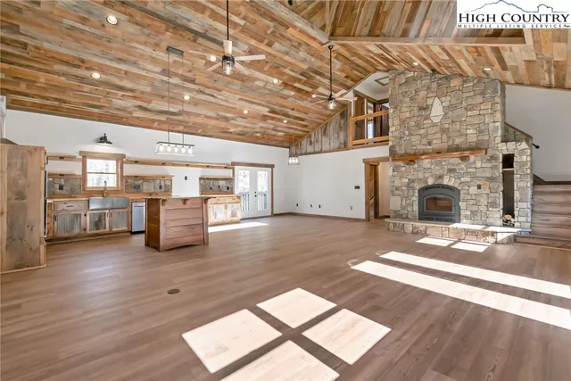 a living room with furniture and fireplace