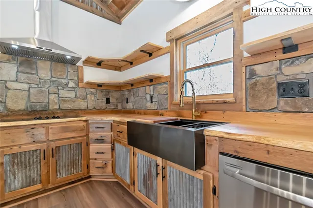 a view of a kitchen with wooden floor